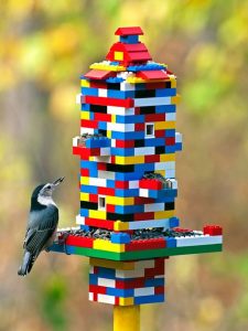 Create this colorful and functional LEGO bird feeder to attract more birds to your garden