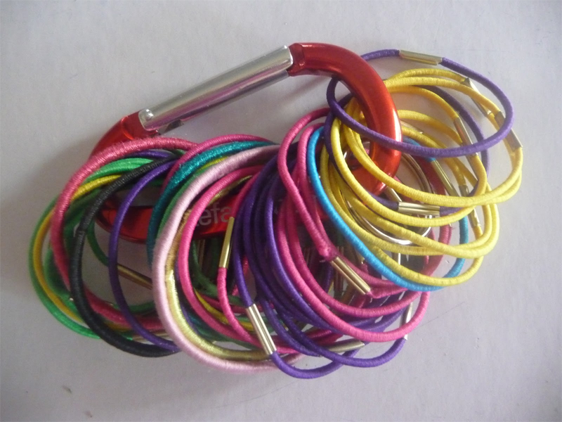 Use a carabiner to get your hair ties organized