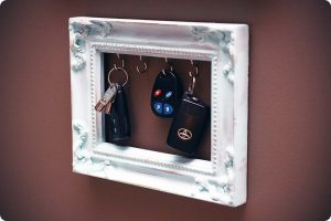 Use a picture frame with installed hooks to store your keys in style