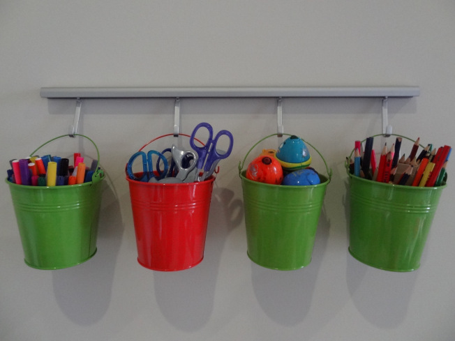 Use small buckets to store pencils, crayons and other craft related items