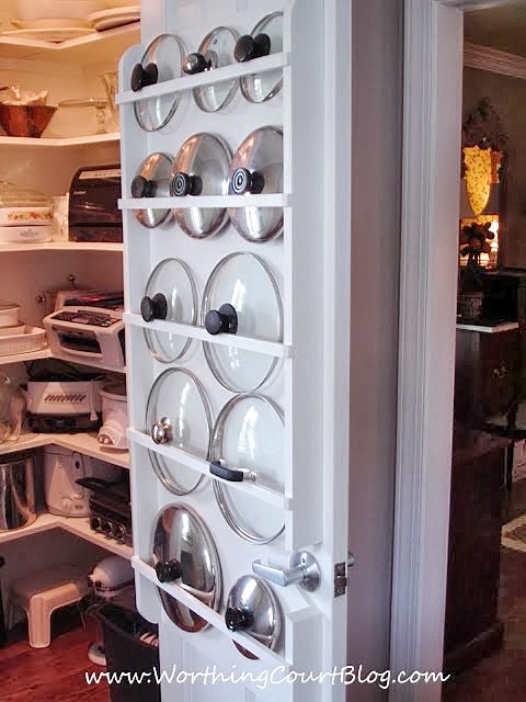 Use curtain rods on the back of pantry door to organize pot lids