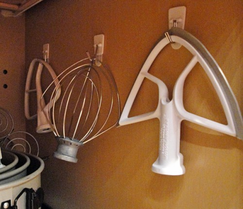 Hang mixer attachments inside cupboards on command hooks