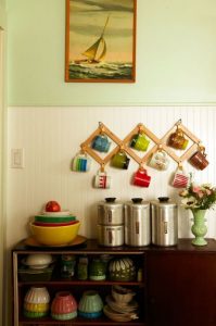 Use a cheap dollar store expanding coat rack to organize your coffee cups