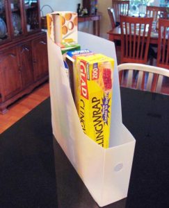 Use magazine holders for storing plastic wrap & aluminum foil boxes