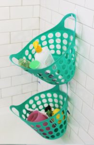Hang Laundry Baskets On Command Hooks To Keep Your Shower Organized