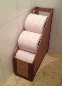 Repurpose a Magazine Rack to Hold Toilet Paper Rolls