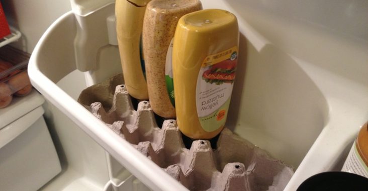 Use the bottom of an egg carton to hold your inverted mustard bottles